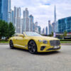 Unveil the allure of a Bentley Continental GTC Rental Dubai under Dubai's sunshine with our premier rental services.